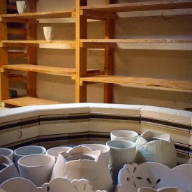 Kristen Kieffer loaded kiln and empty ware shelves